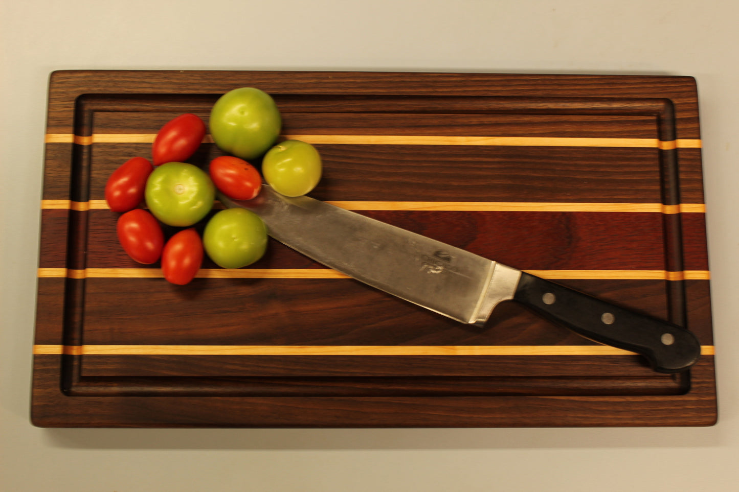 Black Walnut, Hard Maple and Padauk Edge Grain Cutting Board