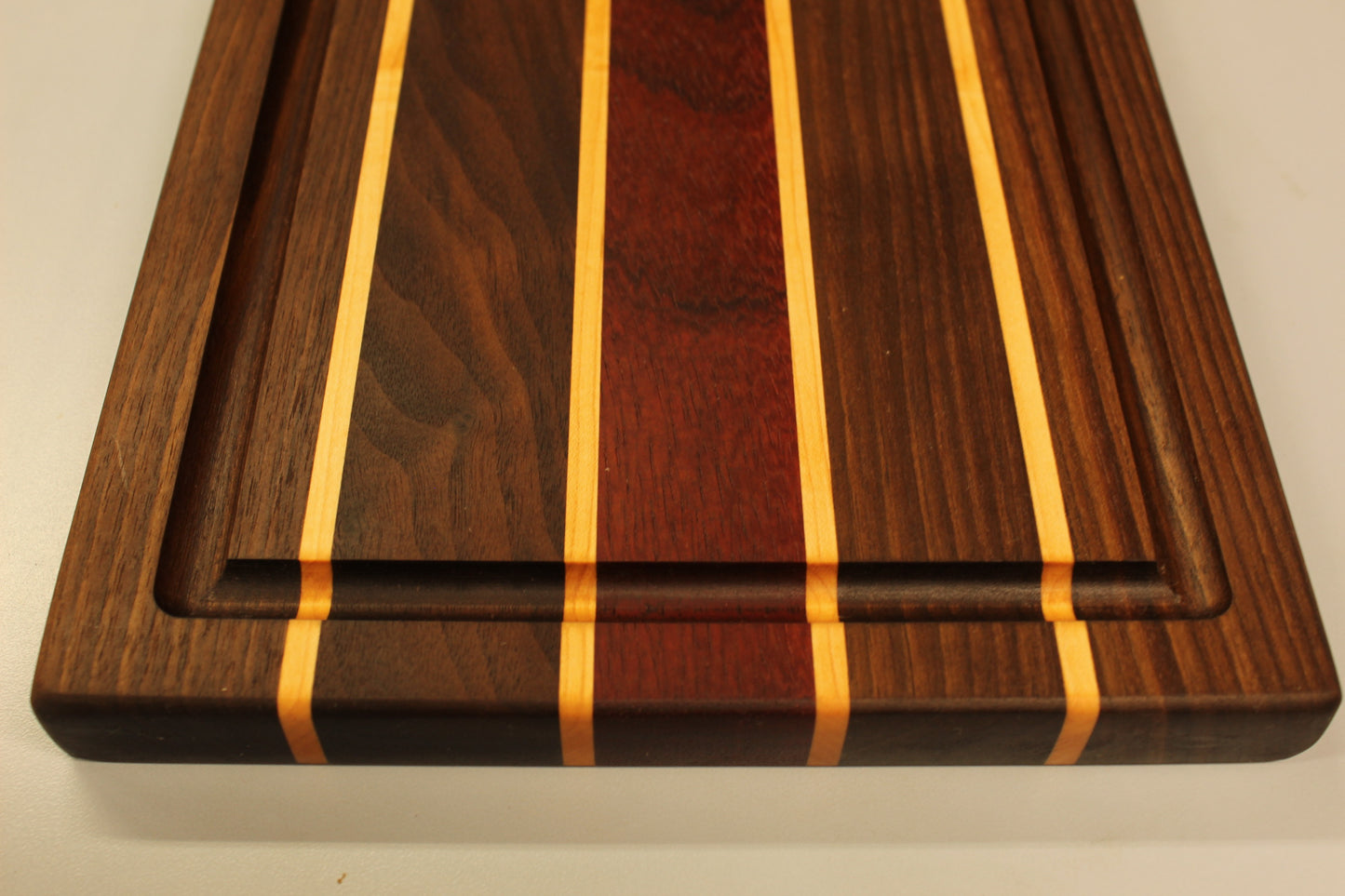 Black Walnut, Hard Maple and Padauk Edge Grain Cutting Board